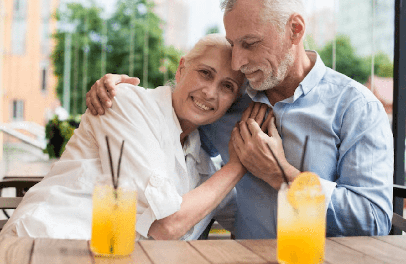 Older couple sitting together at a table